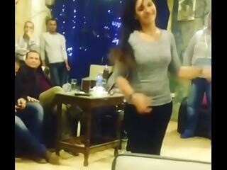 arab lady dancing with buddies in cafe